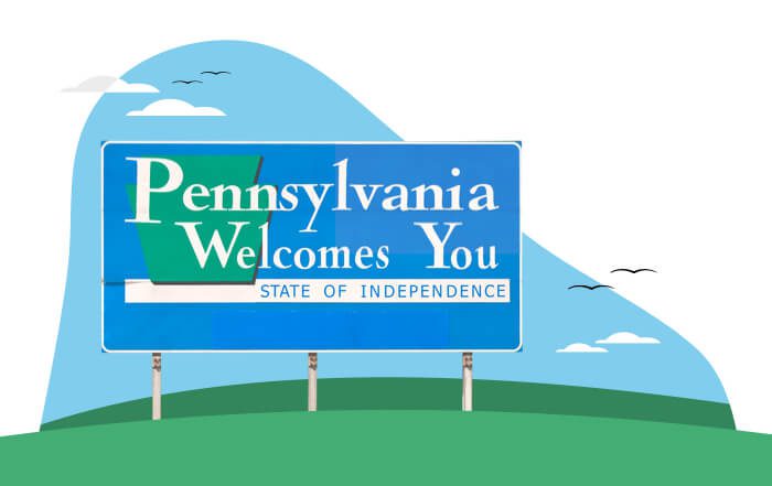 illustration of a blue road sign saying "welcome to pennsylvania" in white text. it sits on a green hill with a blue sky background