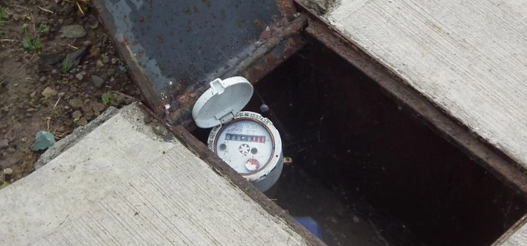 water-meter-in-ground-outside-a-home