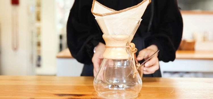 woman-using-a-reusable-coffee-filter