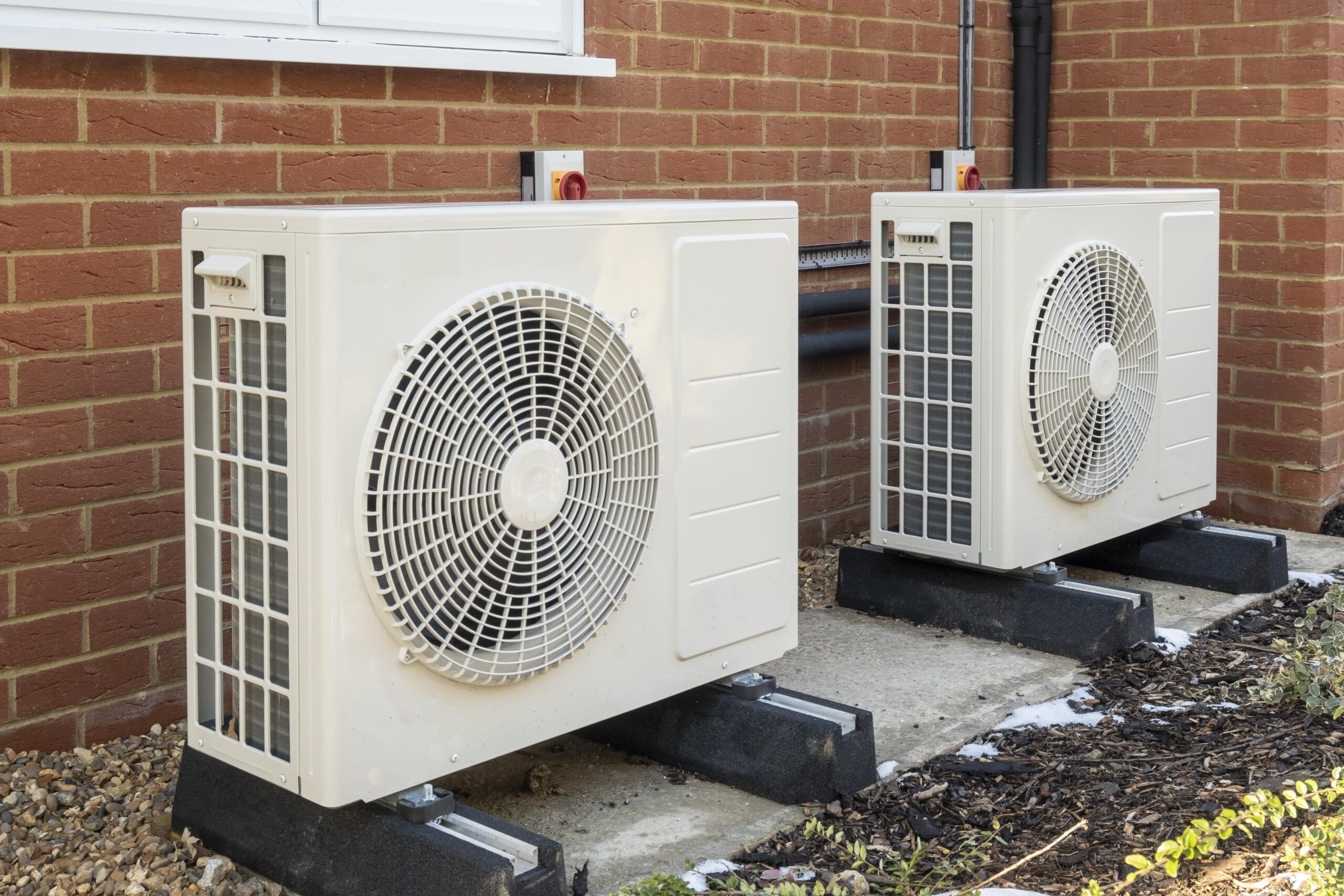 heat pumps on the side of a house