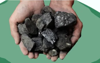 man with coal in his hands