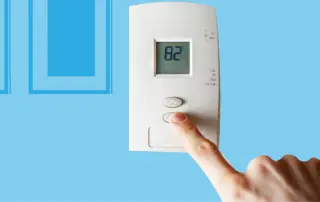 man-turning-down-heat-in-a-home