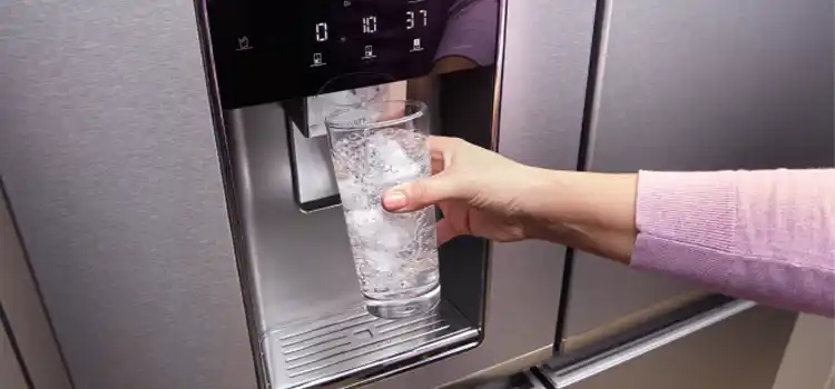 woman filling cup with ice on whirlpool fridge