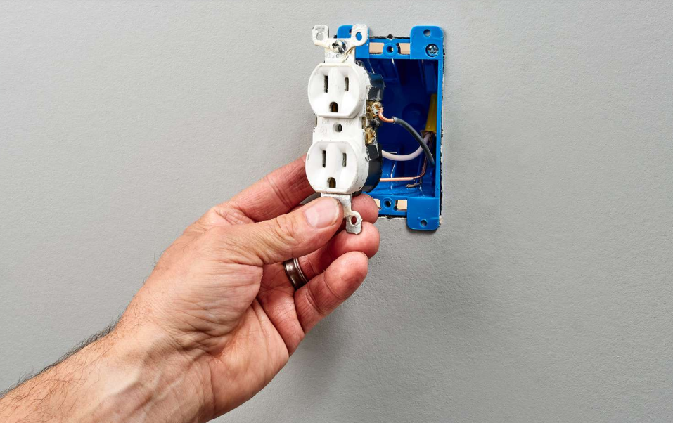 pulling electric outlet out of the wall