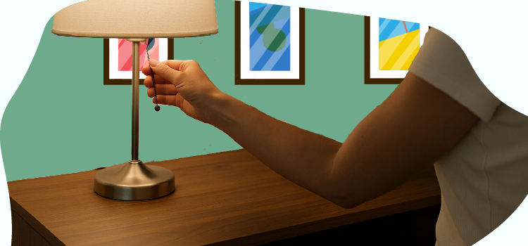 woman-turning-off-a-light-in-her-bedroom