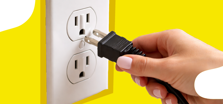 woman plugging in an plug into an outlet woman-plugging-in-an-plug-into-an-outlet
