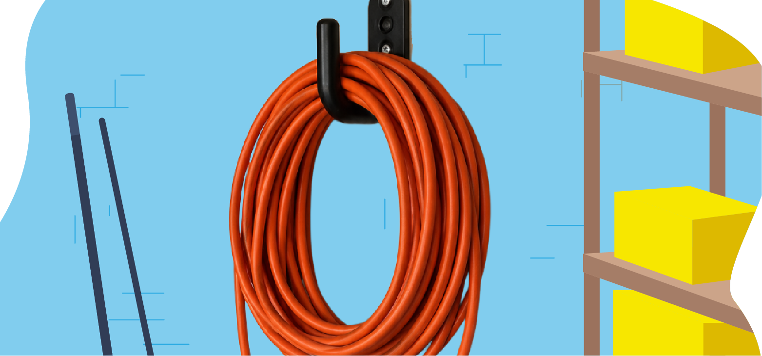 Orange-extension-cord-neatly-coiled-and-hanging-on-a-wall-mounted-hook-in-an-organized-garage